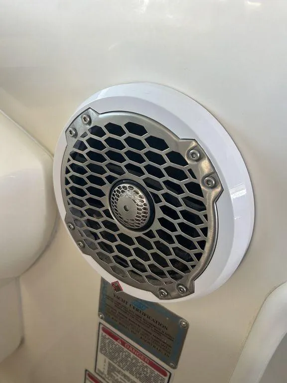 Slide: The Image of Close-up of a speaker on a 1997 Sea Ray 330 Sundancer boat. - 24