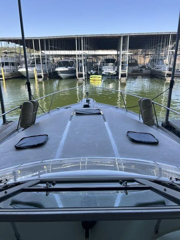 Slide: The Image of 1997 Sea Ray 330 Sundancer docked at a marina. - 39