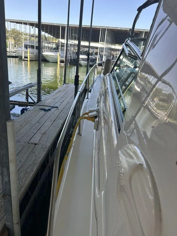 Slide: The Image of 1997 Sea Ray 330 Sundancer docked at a marina. - 42