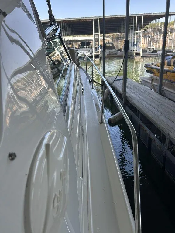 Slide: The Image of 1997 Sea Ray 330 Sundancer docked at a marina. - 43