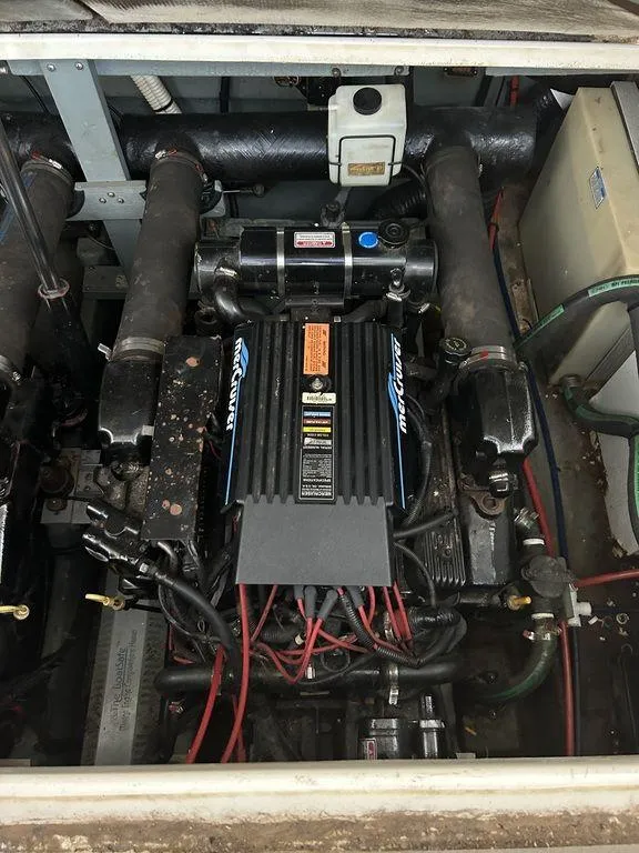 Slide: The Image of 1997 Sea Ray 330 Sundancer engine compartment with MerCruiser engine. - 44