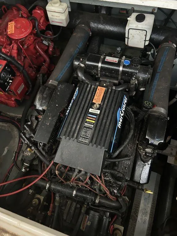 Slide: The Image of 1997 Sea Ray 330 Sundancer engine compartment with MerCruiser engine. - 46