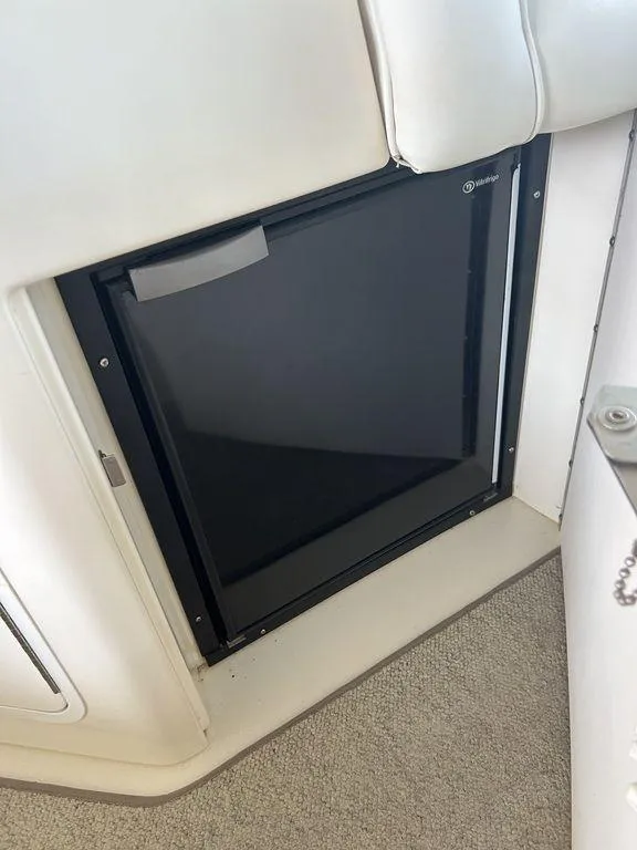 Slide: The Image of Built-in refrigerator on a 1997 Sea Ray 330 Sundancer boat. - 48