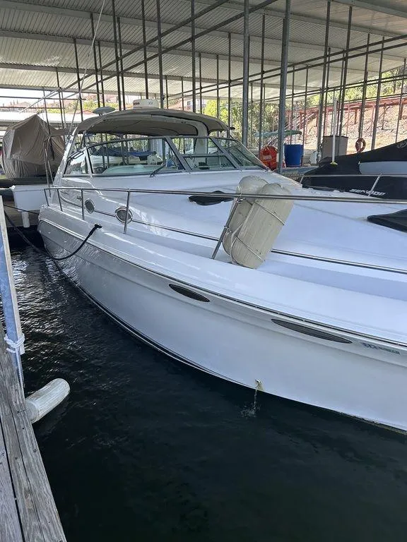 Slide: The Image of 1997 Sea Ray 330 Sundancer docked in a marina. - 5