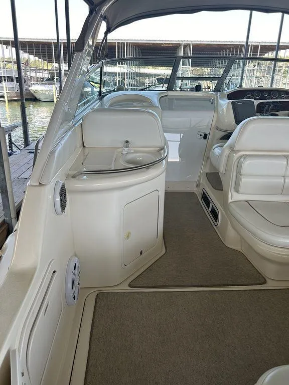 Slide: The Image of 1997 Sea Ray 330 Sundancer boat interior with seating and helm. - 6