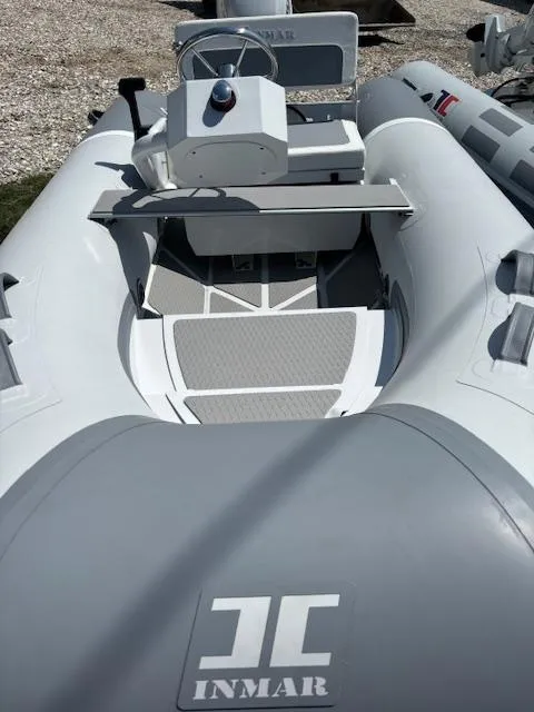Slide: The Image of 2024 Inmar 325R-AL inflatable boat with steering console and seating. - 4