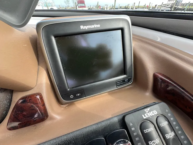 Slide: The Image of Raymarine display on 2016 Crownline 270 SS boat dashboard with Lenco controls. - 15