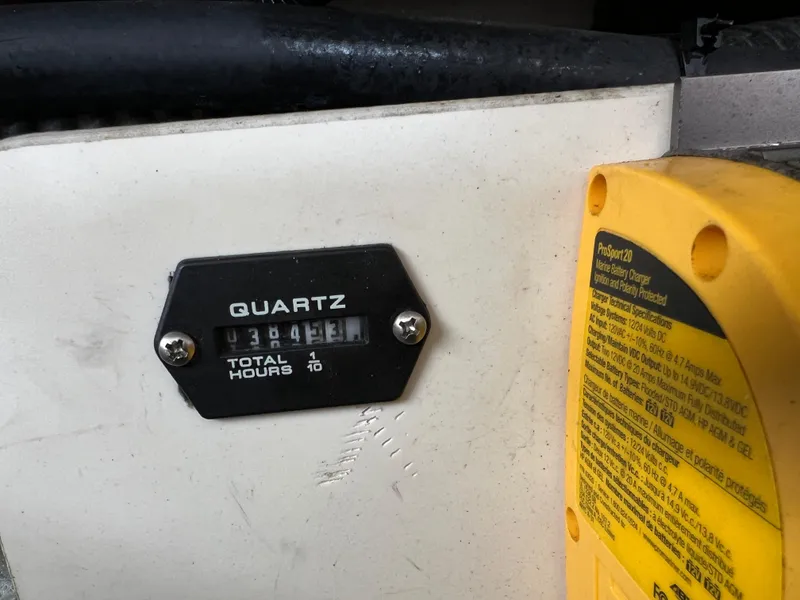 Slide: The Image of Hour meter reading 384.3 hours on 2016 Crownline 270 SS boat. - 17
