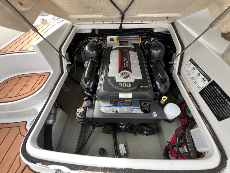 Slide: The Image of Engine compartment of a 2016 Crownline 270 SS boat, featuring a 6.2L Mercury engine. - 24