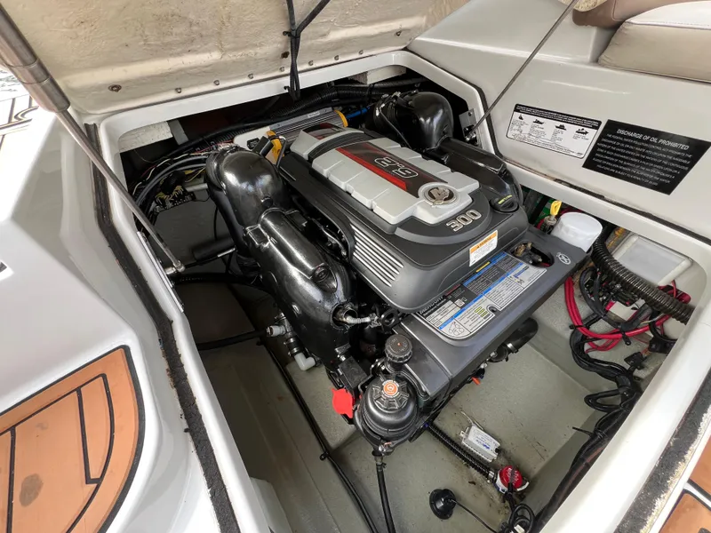 Slide: The Image of Engine compartment of a 2016 Crownline 270 SS boat, showcasing a powerful 300 HP engine. - 25