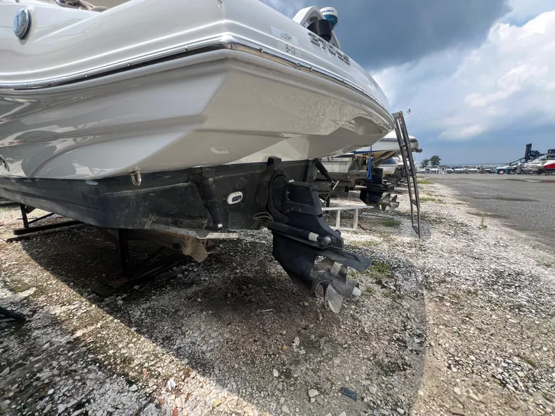 Slide: The Image of 2016 Crownline 270 SS boat on dry dock, showcasing hull and propeller. - 30
