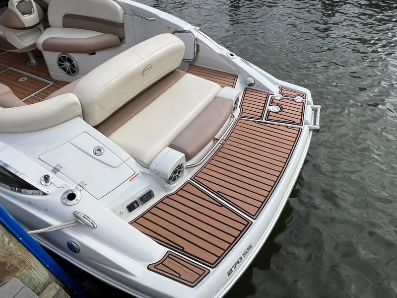Slide: The Image of 2016 Crownline 270 SS boat with teak deck and comfortable seating by the water. - 9