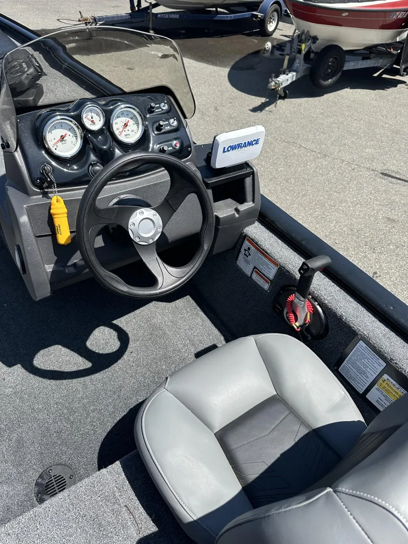 Slide: The Image of 2023 Tracker Pro 170 boat dashboard and steering wheel with Lowrance electronics. - 10