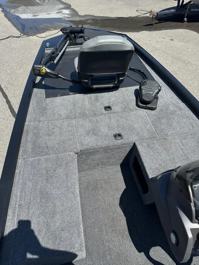 Slide: The Image of 2023 Tracker Pro 170 fishing boat with gray interior and seating. - 13