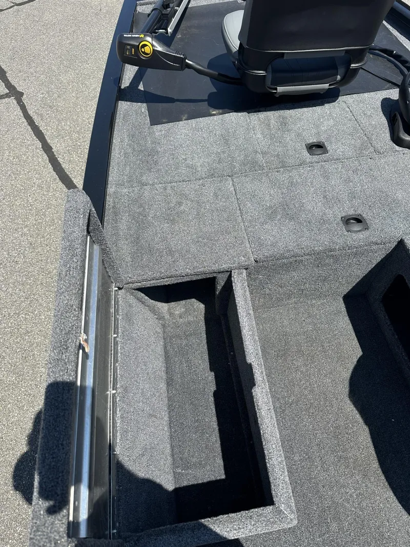 Slide: The Image of 2023 Tracker Pro 170 boat interior with open storage compartment. - 14