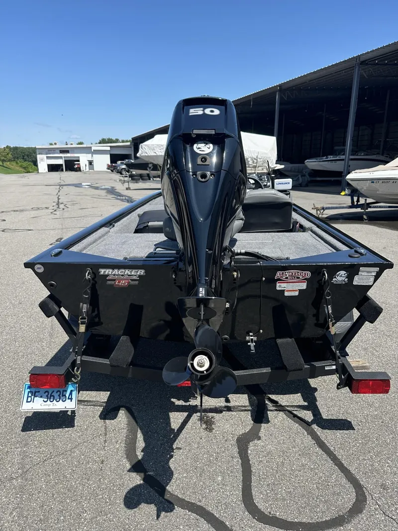Slide: The Image of 2023 Tracker Pro 170 boat with a 50 HP outboard motor, rear view. - 3
