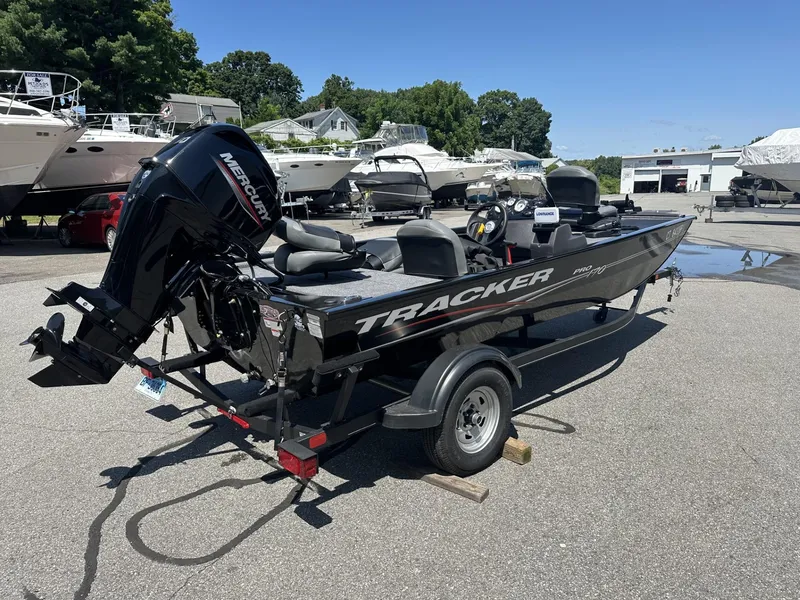 Slide: The Image of 2023 Tracker Pro 170 boat on trailer in marina parking lot. - 4