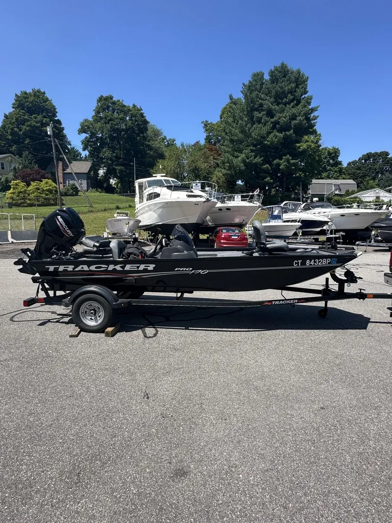 Slide: The Image of 2023 Tracker Pro 170 boat on trailer in parking lot. - 5