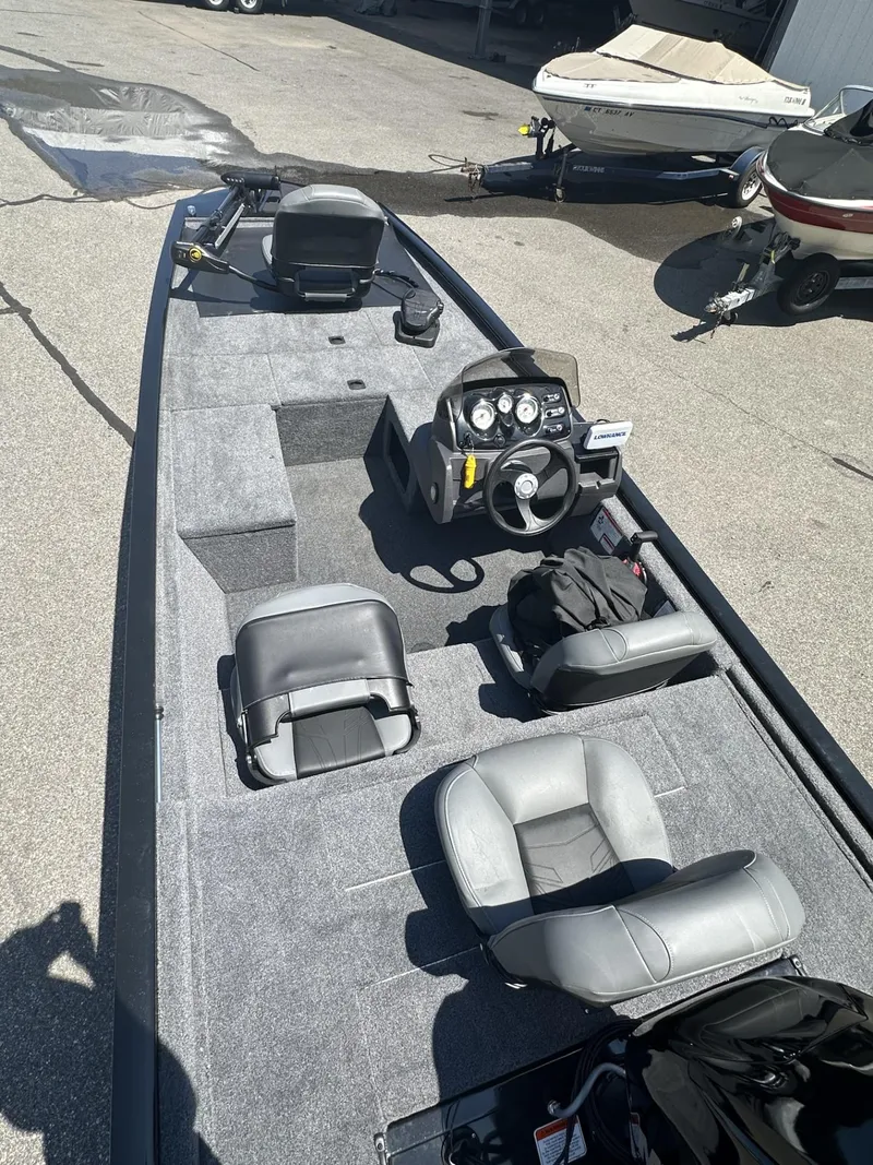 Slide: The Image of 2023 Tracker Pro 170 fishing boat with gray interior and steering console. - 7