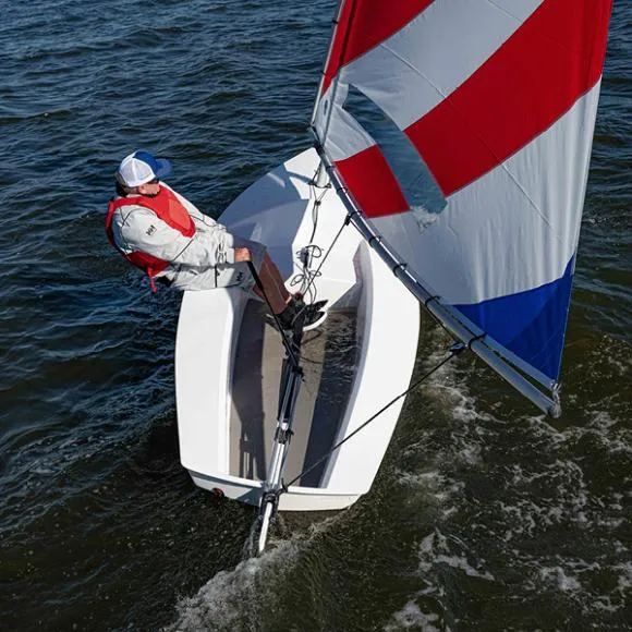 The Image of Sailor navigating 2024 Fulcrum Speedworks Rocket sailboat on open water. - 0