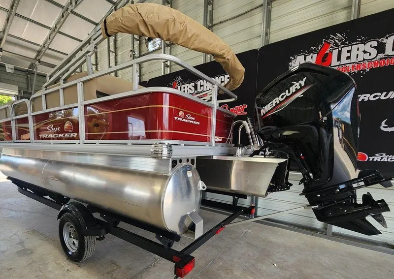 Slide: The Image of 2025 Sun Tracker PARTY BARGE® 18 DLX pontoon boat with Mercury outboard motor. - 3
