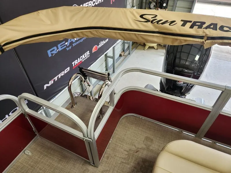 Slide: The Image of 2025 Sun Tracker PARTY BARGE® 18 DLX interior with canopy and seating. - 6
