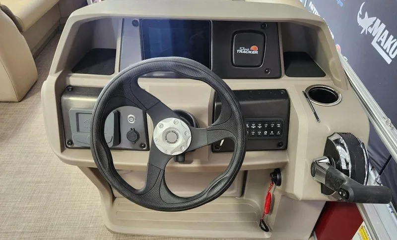 Slide: The Image of 2025 Sun Tracker PARTY BARGE® 18 DLX steering console with controls and cup holder. - 9