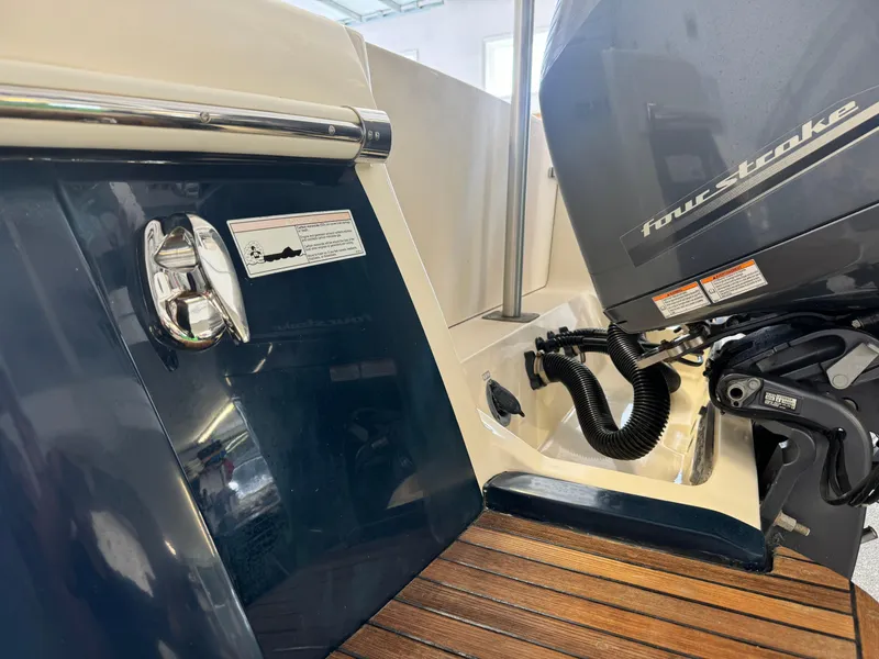 Slide: The Image of 2014 Scout 275 Dorado boat with four-stroke engine and teak deck. - 10