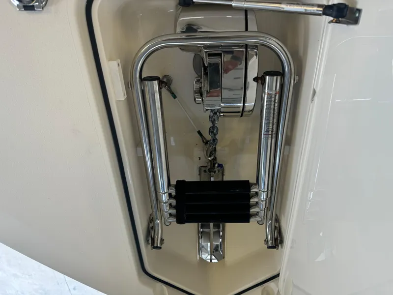 Slide: The Image of 2014 Scout 275 Dorado boat anchor compartment with stainless steel hardware. - 24