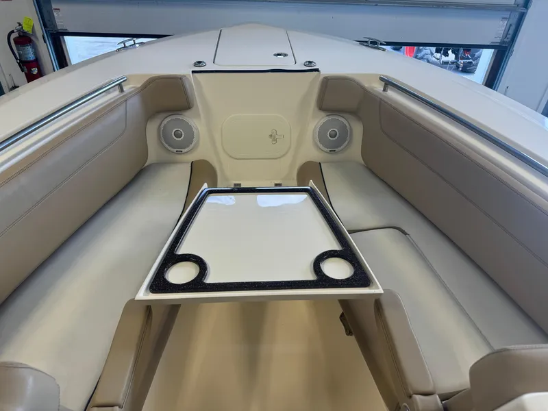 Slide: The Image of 2014 Scout 275 Dorado boat interior with seating and table. - 25