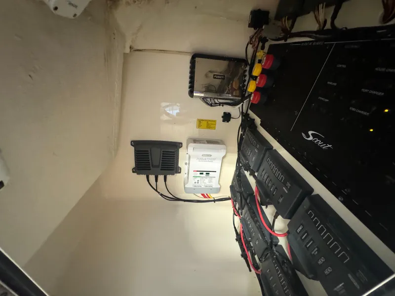 Slide: The Image of Electrical panel and wiring inside a 2014 Scout 275 Dorado boat. - 30