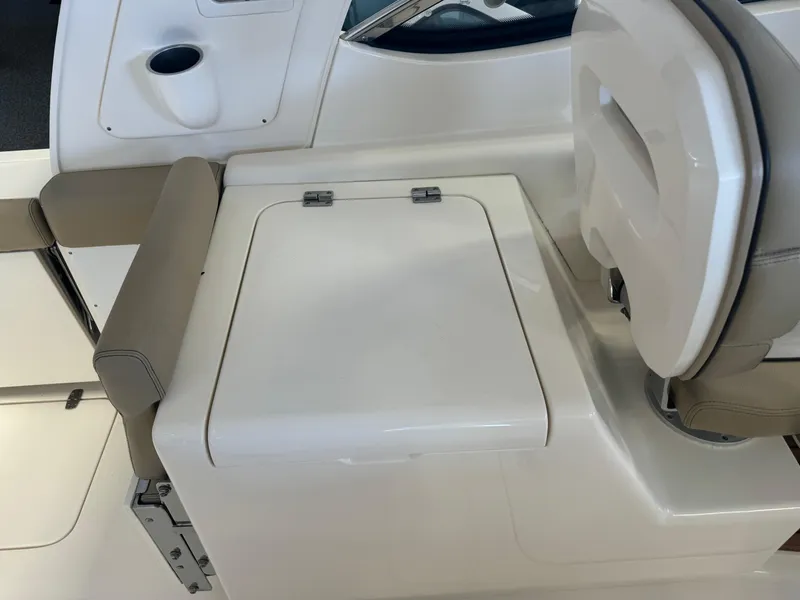 Slide: The Image of 2014 Scout 275 Dorado boat interior seating and storage compartment. - 35