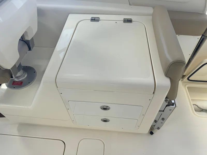 Slide: The Image of 2014 Scout 275 Dorado boat seating and storage compartment. - 39
