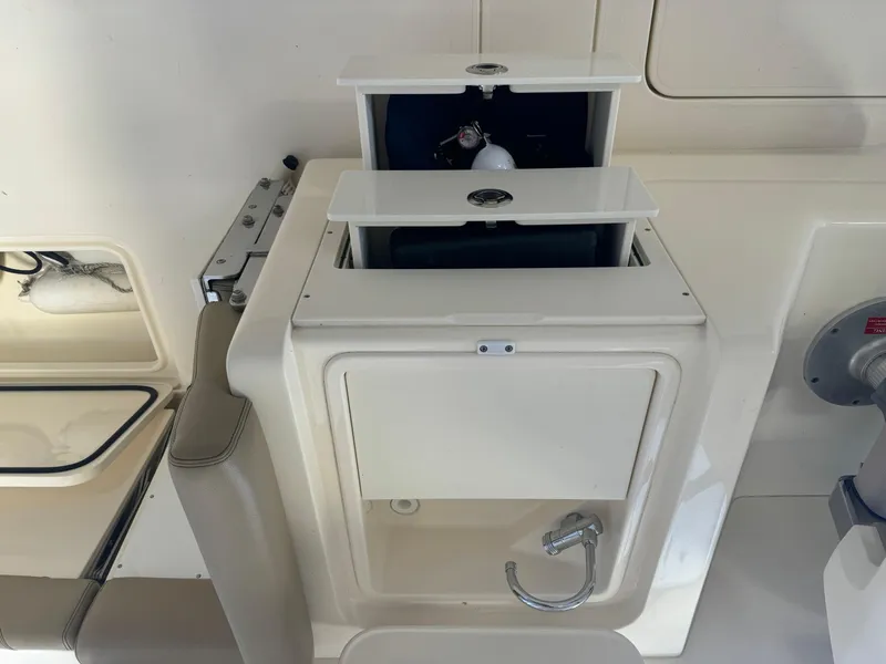 Slide: The Image of 2014 Scout 275 Dorado boat storage compartment with open hatches. - 40