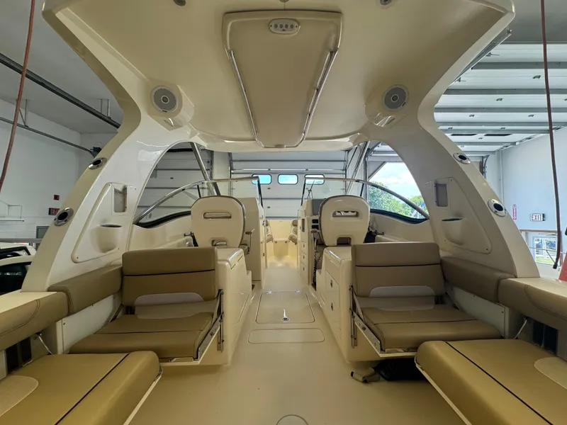 Slide: The Image of 2014 Scout 275 Dorado boat interior with beige seating and modern design. - 43