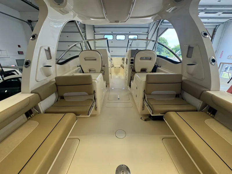 Slide: The Image of 2014 Scout 275 Dorado boat interior with tan seating and modern design. - 44