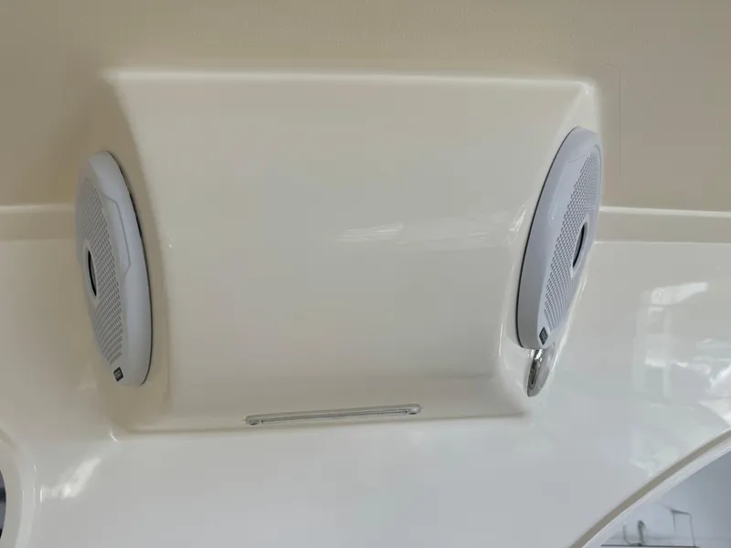 Slide: The Image of 2014 Scout 275 Dorado boat speakers mounted on white panel. - 49
