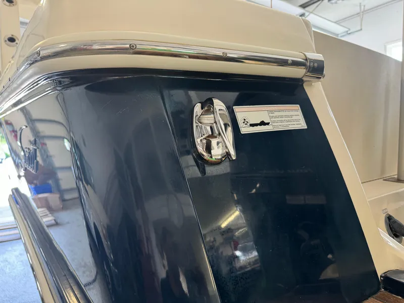 Slide: The Image of 2014 Scout 275 Dorado boat stern in a garage. - 9