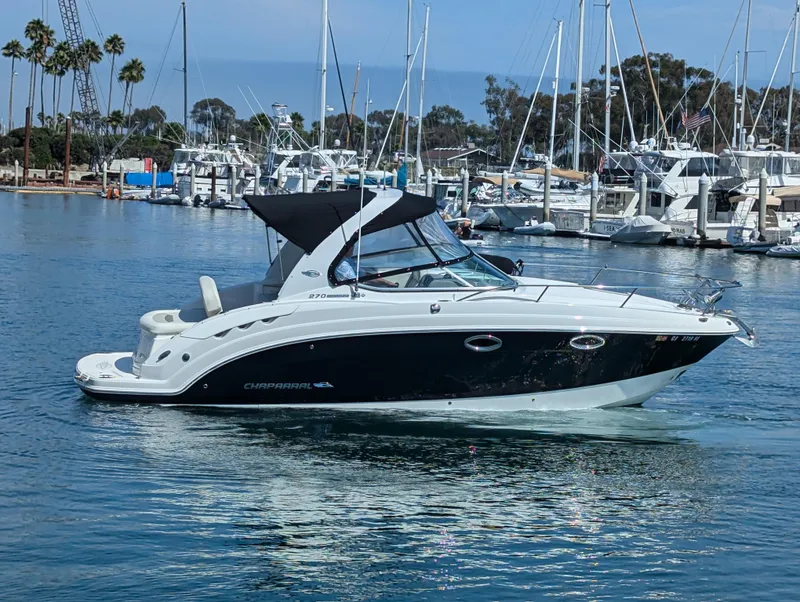 Slide: The Image of 2011 Chaparral Signature 270 boat in a marina with other yachts. - 20