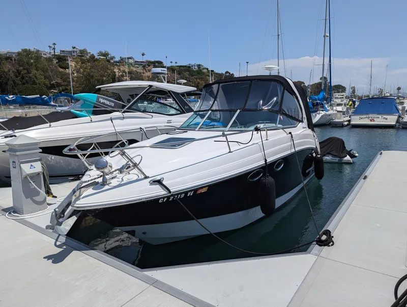 Slide: The Image of 2011 Chaparral Signature 270 boat docked at a marina. - 21