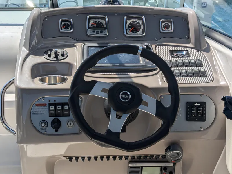 Slide: The Image of 2011 Chaparral Signature 270 helm with steering wheel and control panel. - 27