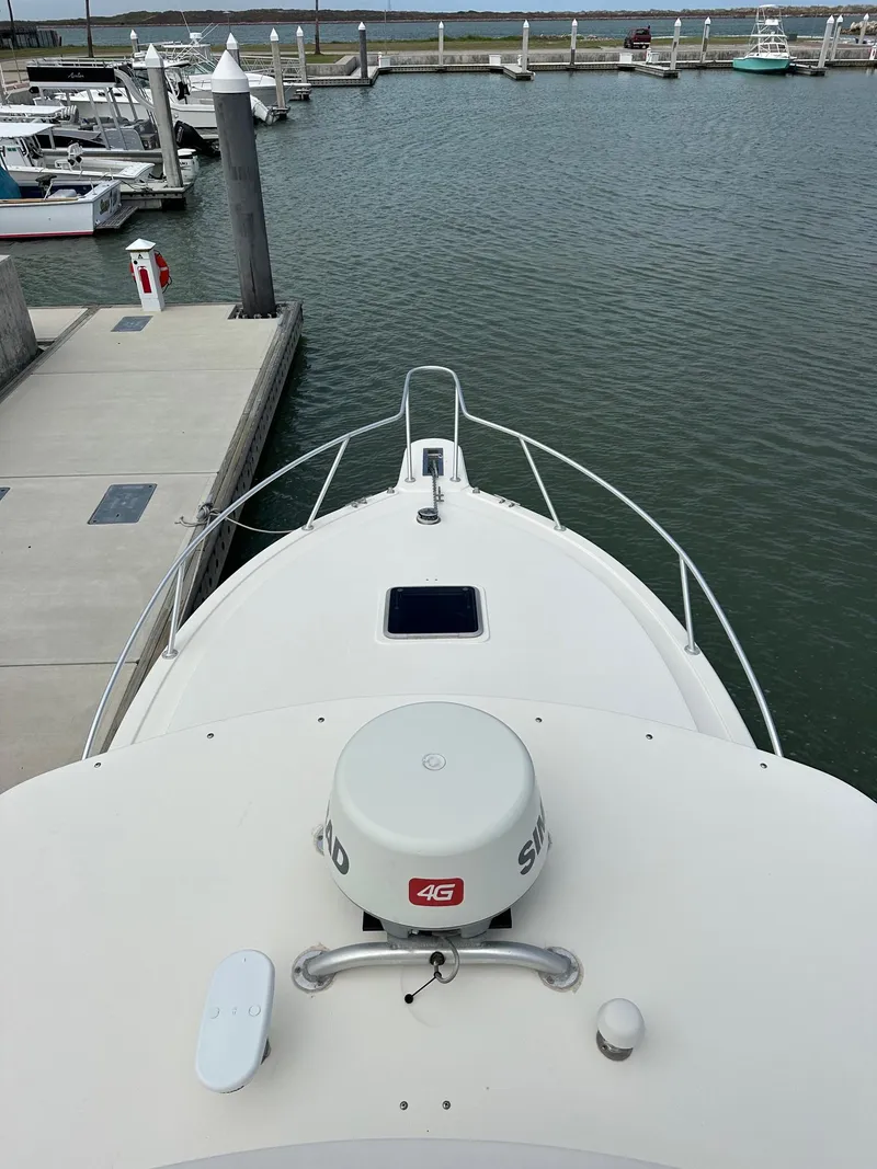 Slide: The Image of 2006 Albemarle 320 Express Fisherman boat interior with seating and helm station. - 10