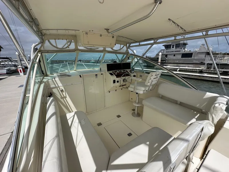 Slide: The Image of 2006 Albemarle 320 Express Fisherman boat helm with navigation instruments and steering wheel. - 6