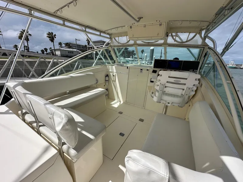 Slide: The Image of 2006 Albemarle 320 Express Fisherman electronics compartment with marine radio. - 7