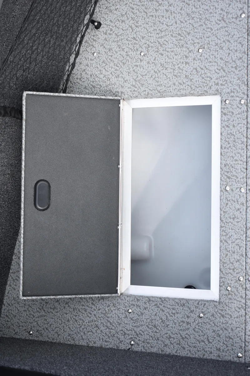 Slide: The Image of Open storage compartment on 2023 Crestliner 2250 Authority boat. - 13