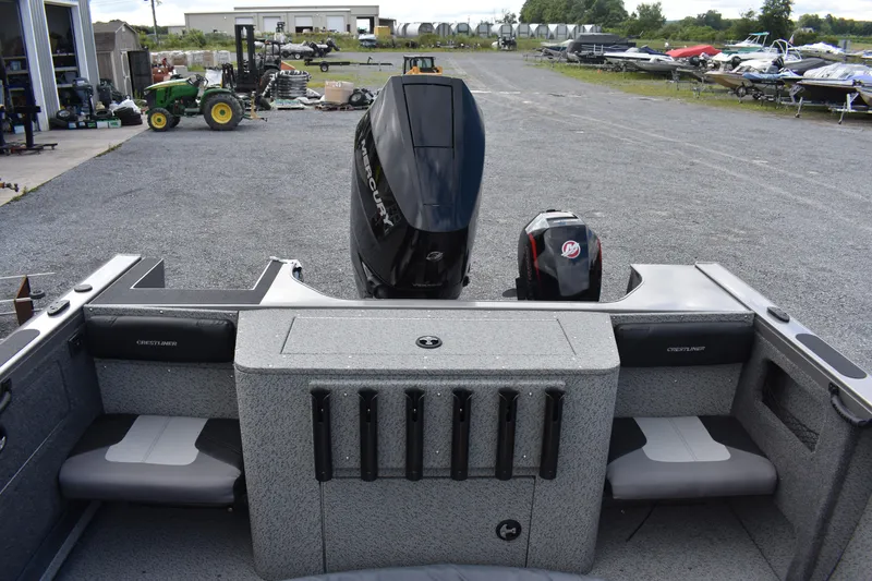 Slide: The Image of 2023 Crestliner 2250 Authority boat with outboard motor, rear seating, and rod holders. - 18
