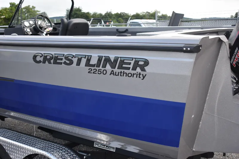 Slide: The Image of 2023 Crestliner 2250 Authority boat side view with logo and model name. - 3