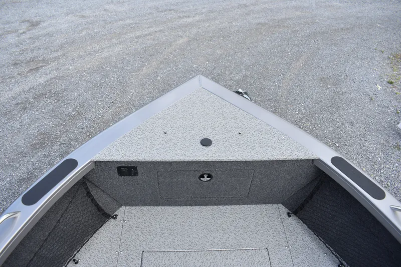 Slide: The Image of 2023 Crestliner 2250 Authority boat bow with spacious deck and storage compartments. - 6