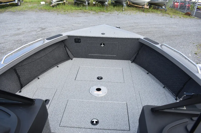 Slide: The Image of 2023 Crestliner 2250 Authority boat interior with storage compartments. - 7