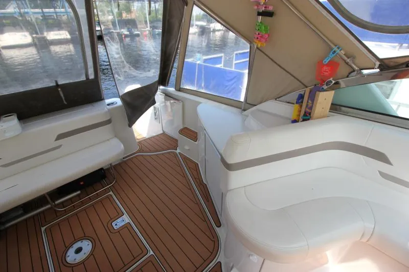Slide: The Image of Interior of a 2001 Formula 41 PC boat with teak flooring and white seating. - 10